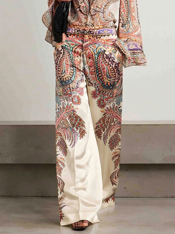 Paisley print blouse front with ruffle V-neck and long bell sleeves