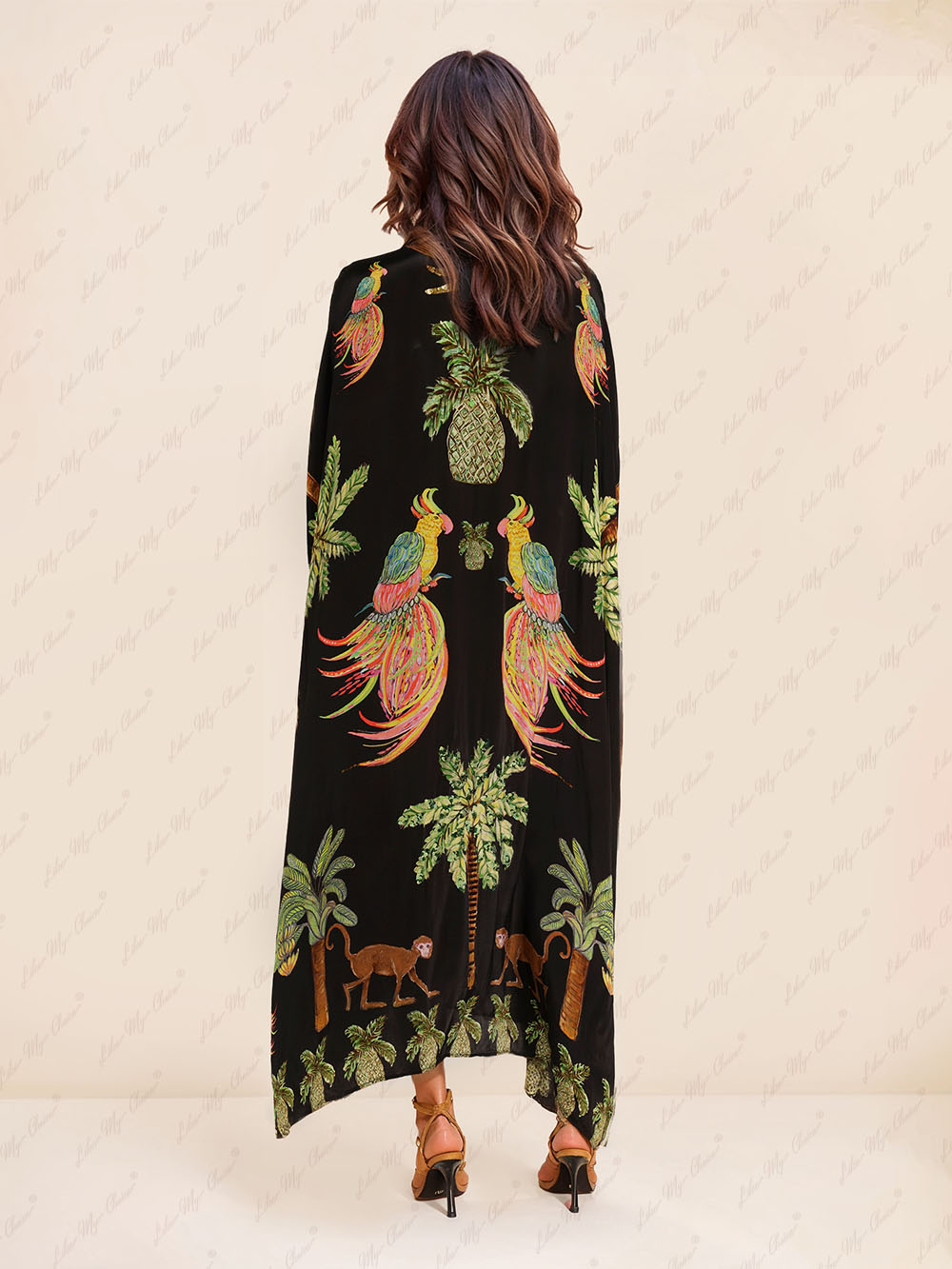Black tropical print kaftan maxi dress, back view with gold sequin V-neck detail.