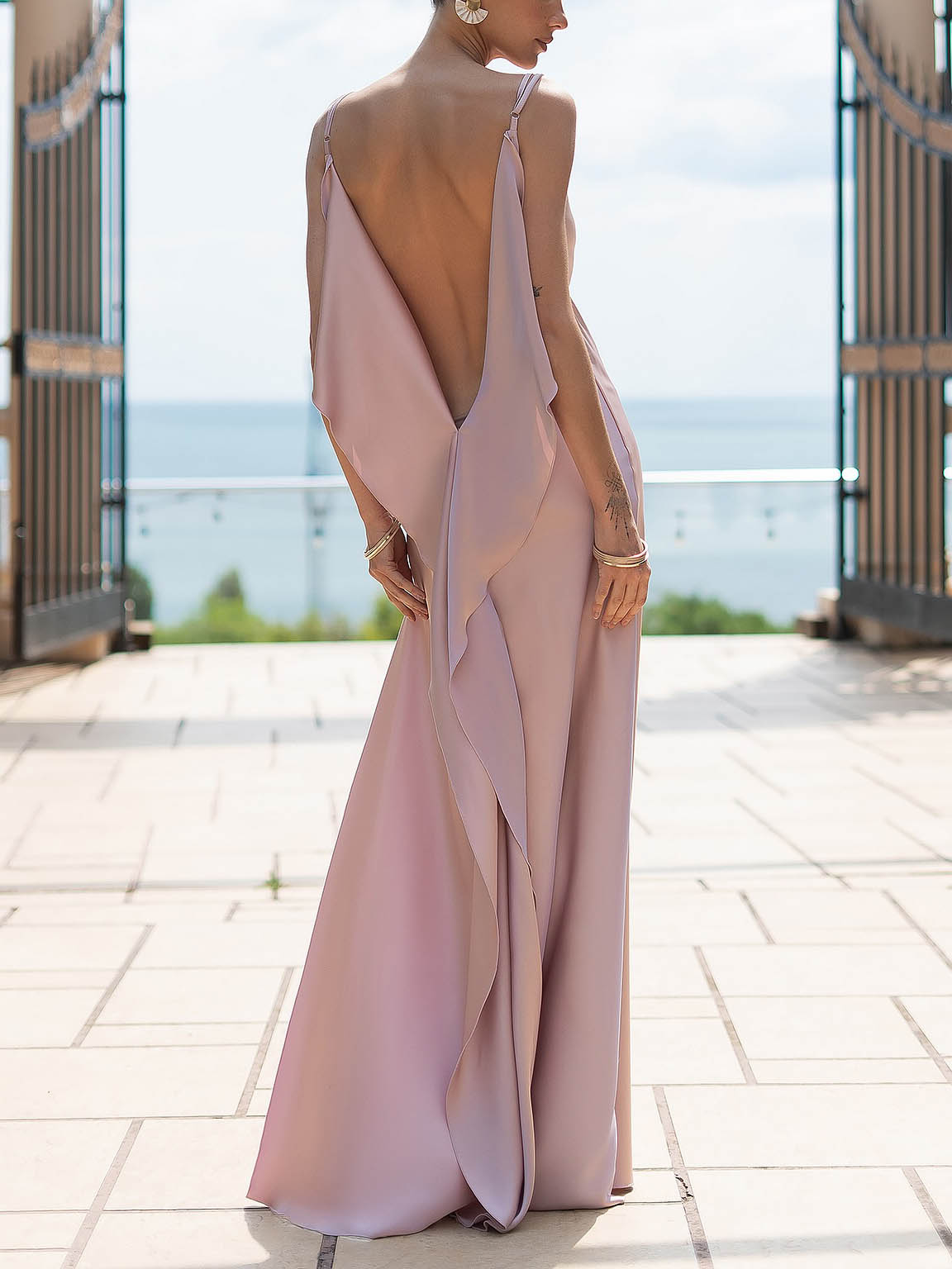 Blush satin cowl neck slip maxi dress with open back and draped side detail