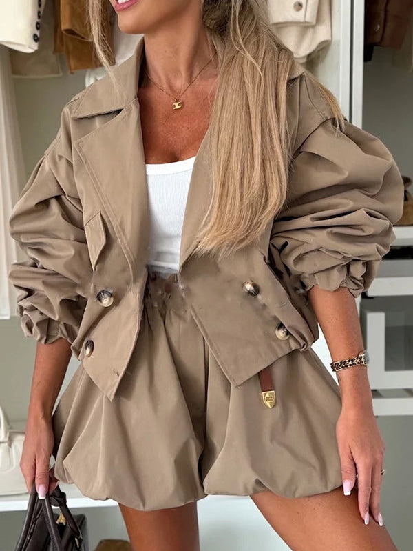 Army green high-waist cotton paperbag shorts with belt, pleats, and balloon fit