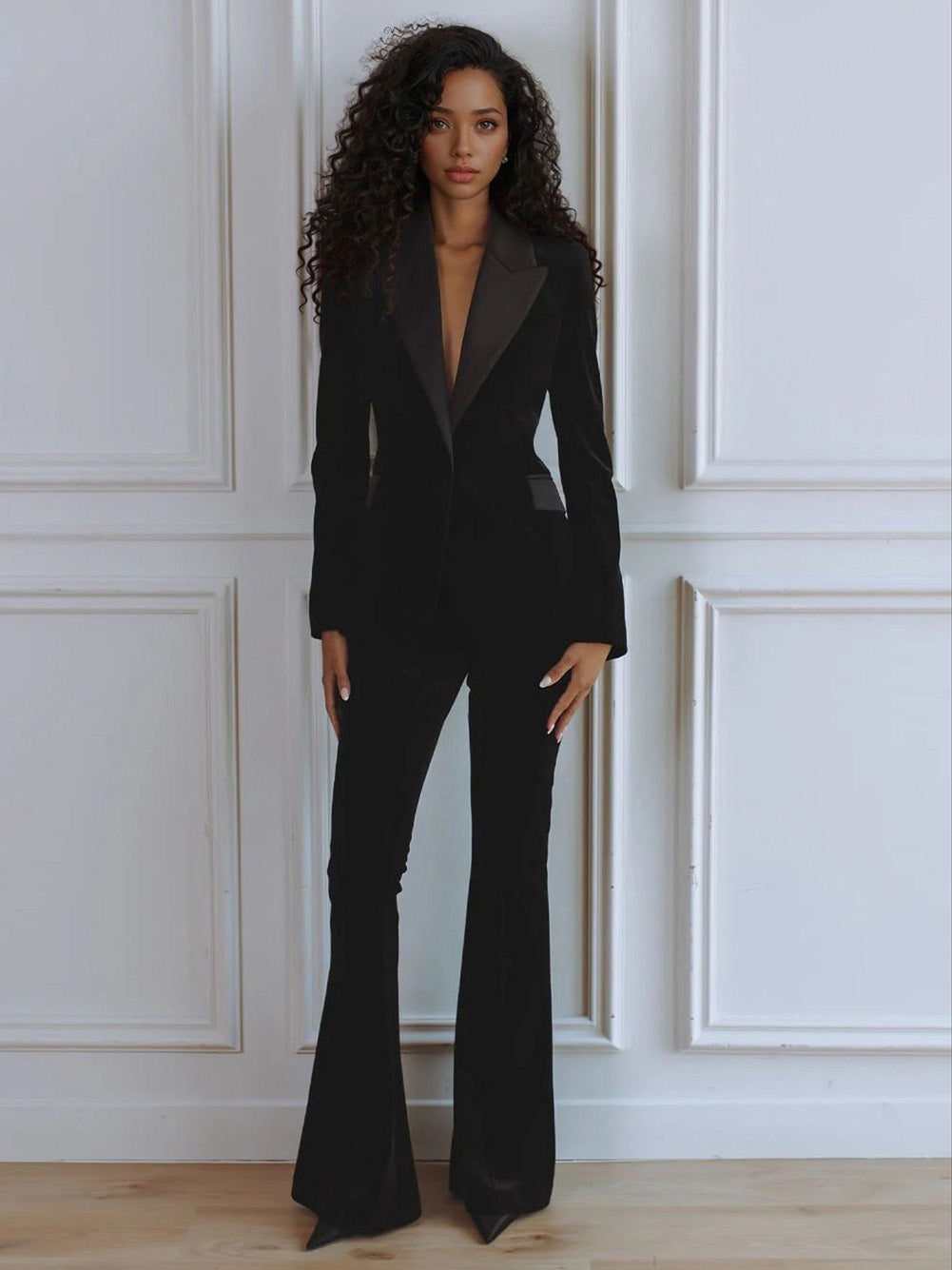 Women's black velvet slim-fit blazer with satin lapel trim and single-button closure