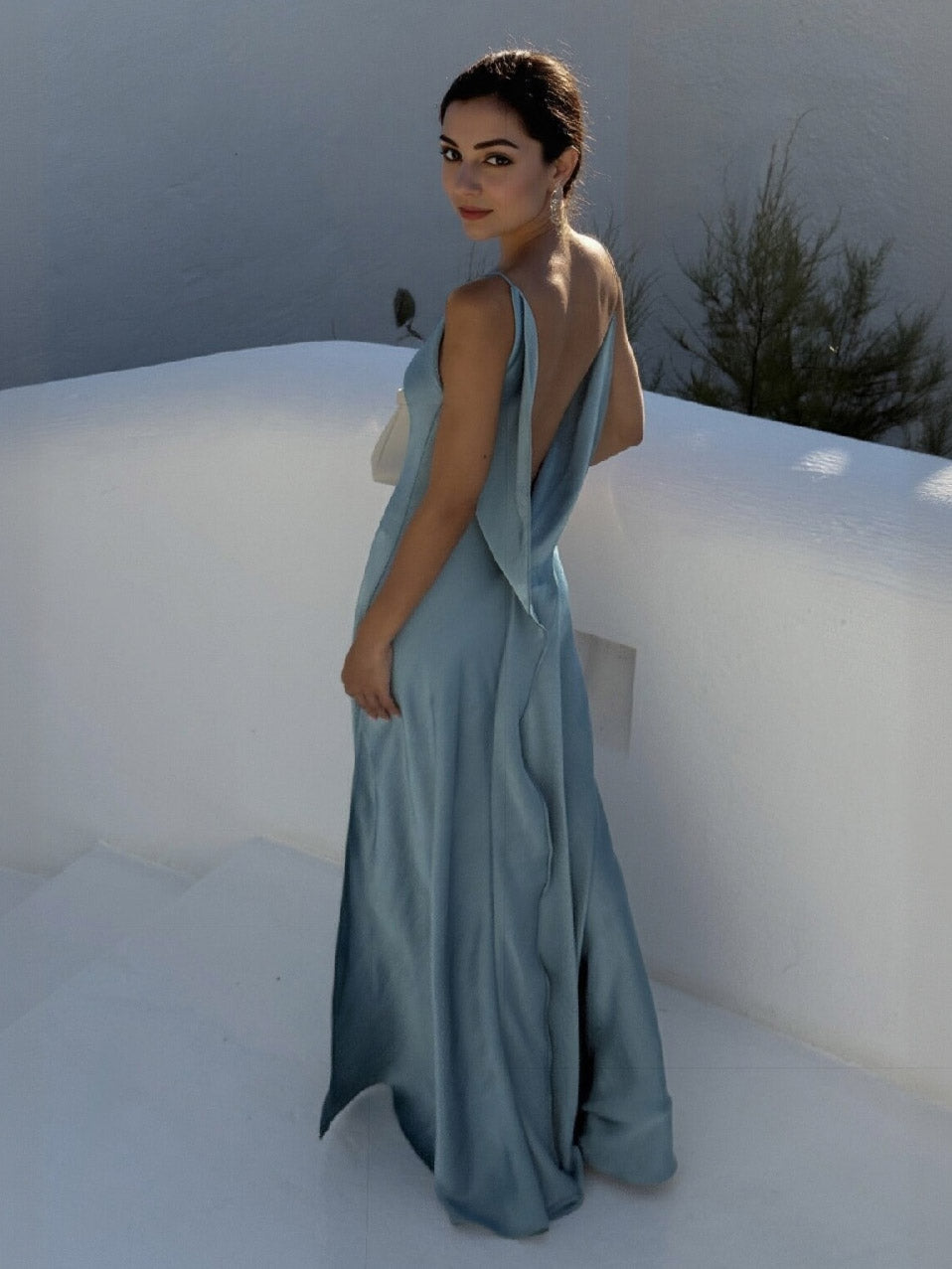 Sky blue satin slip maxi dress with cowl neckline, spaghetti straps, and high side slit.