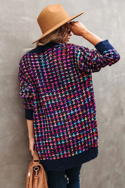 Multicolor knit cardigan on navy base, purple/pink/teal pattern; ribbed cuffs and hem