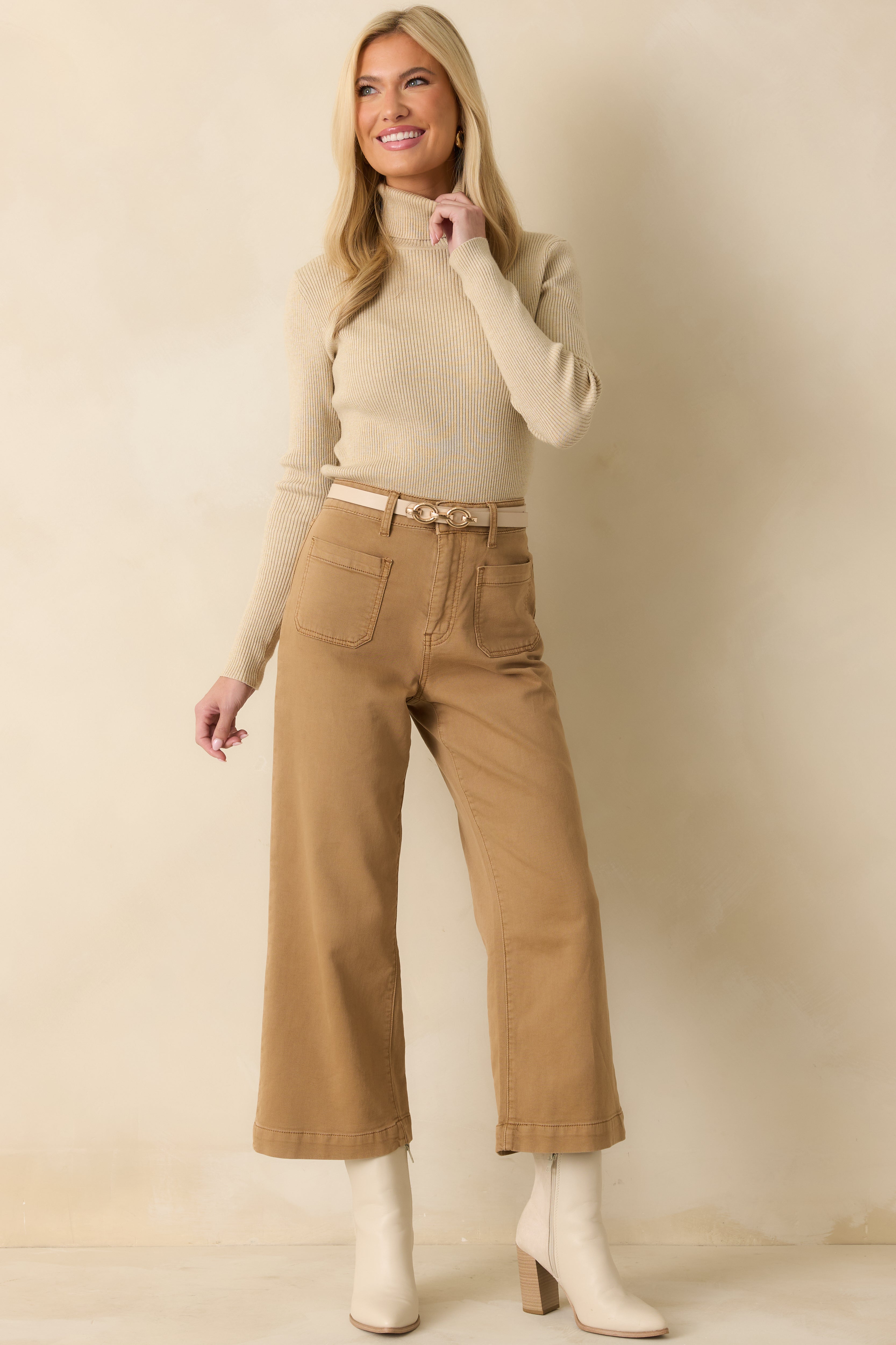 Beige ribbed long-sleeve turtleneck sweater on model