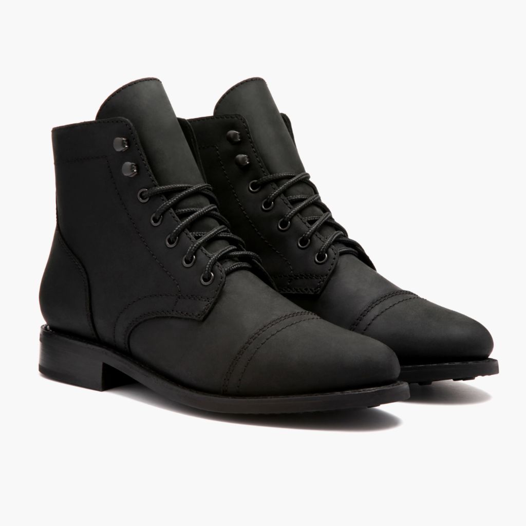 Pair of black matte lace-up ankle boots, padded collar and low block heel