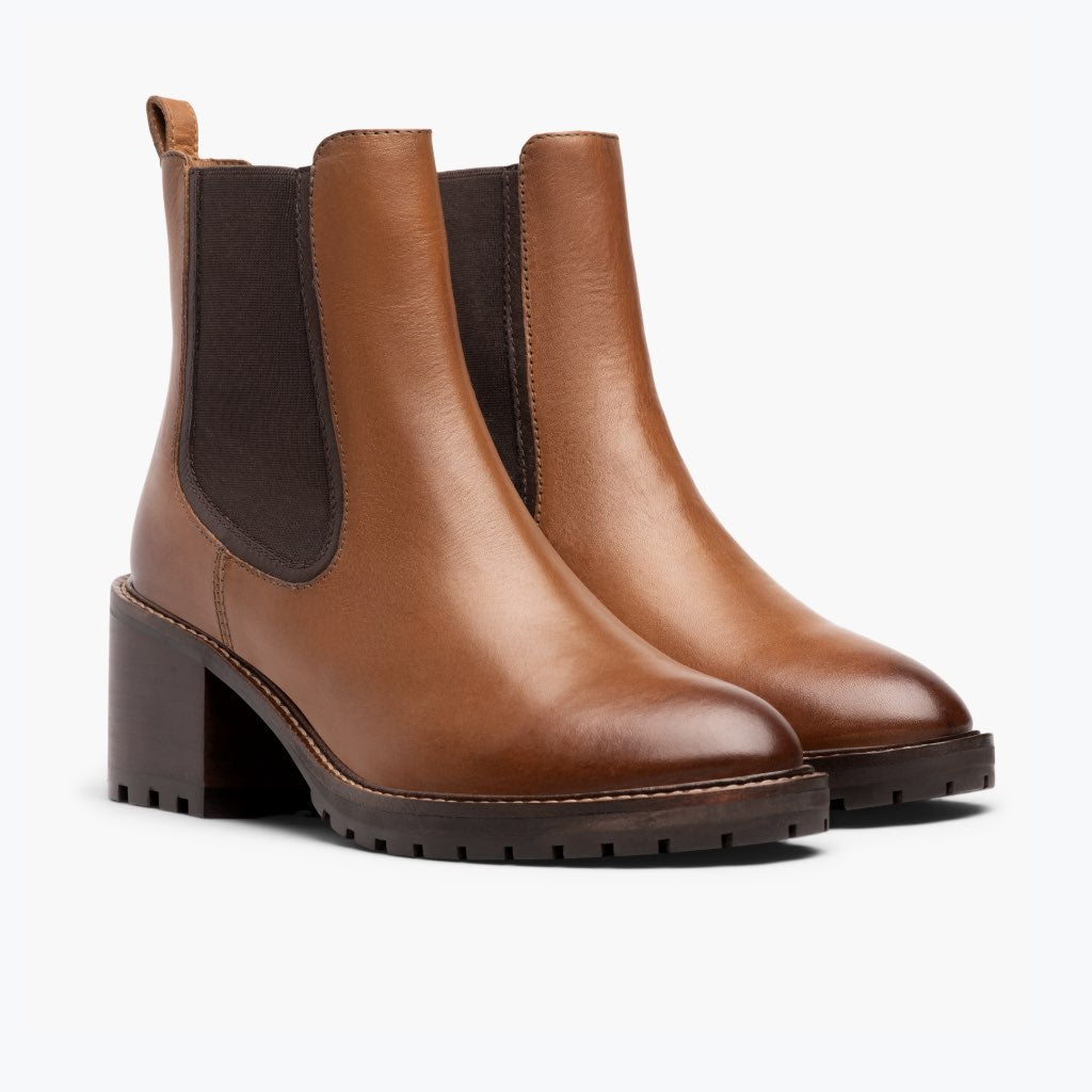 Brown chelsea boots with dark elastic gore panels and thick tread sole