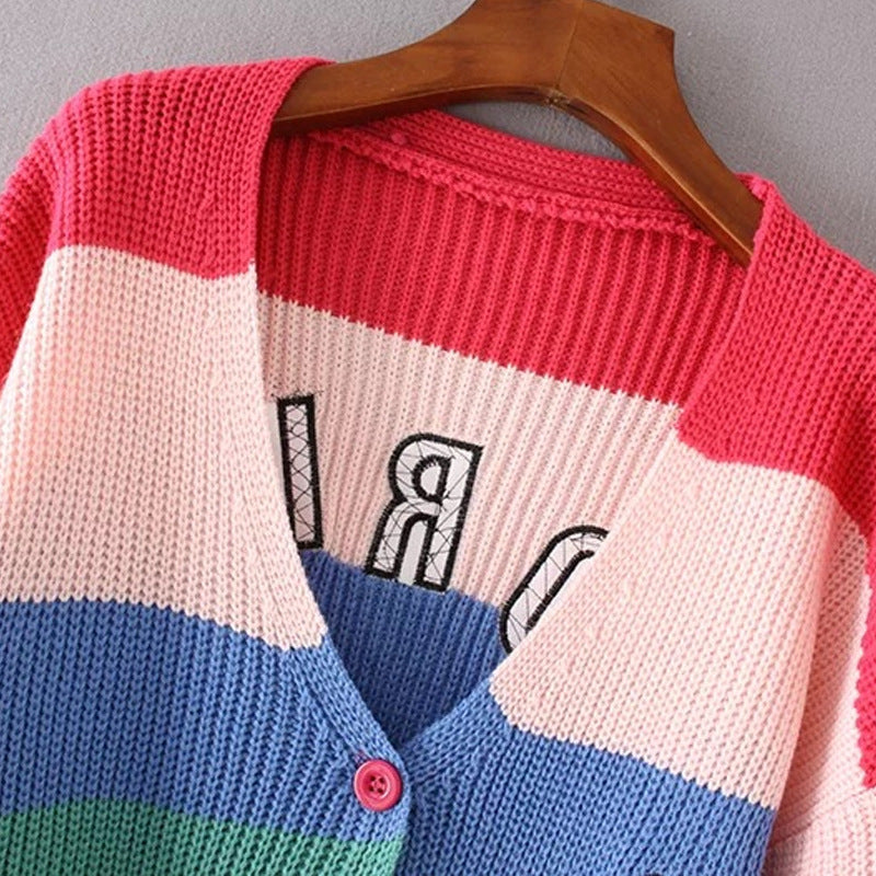 V-neck colorblock knit cardigan with red button placket and rainbow stripes