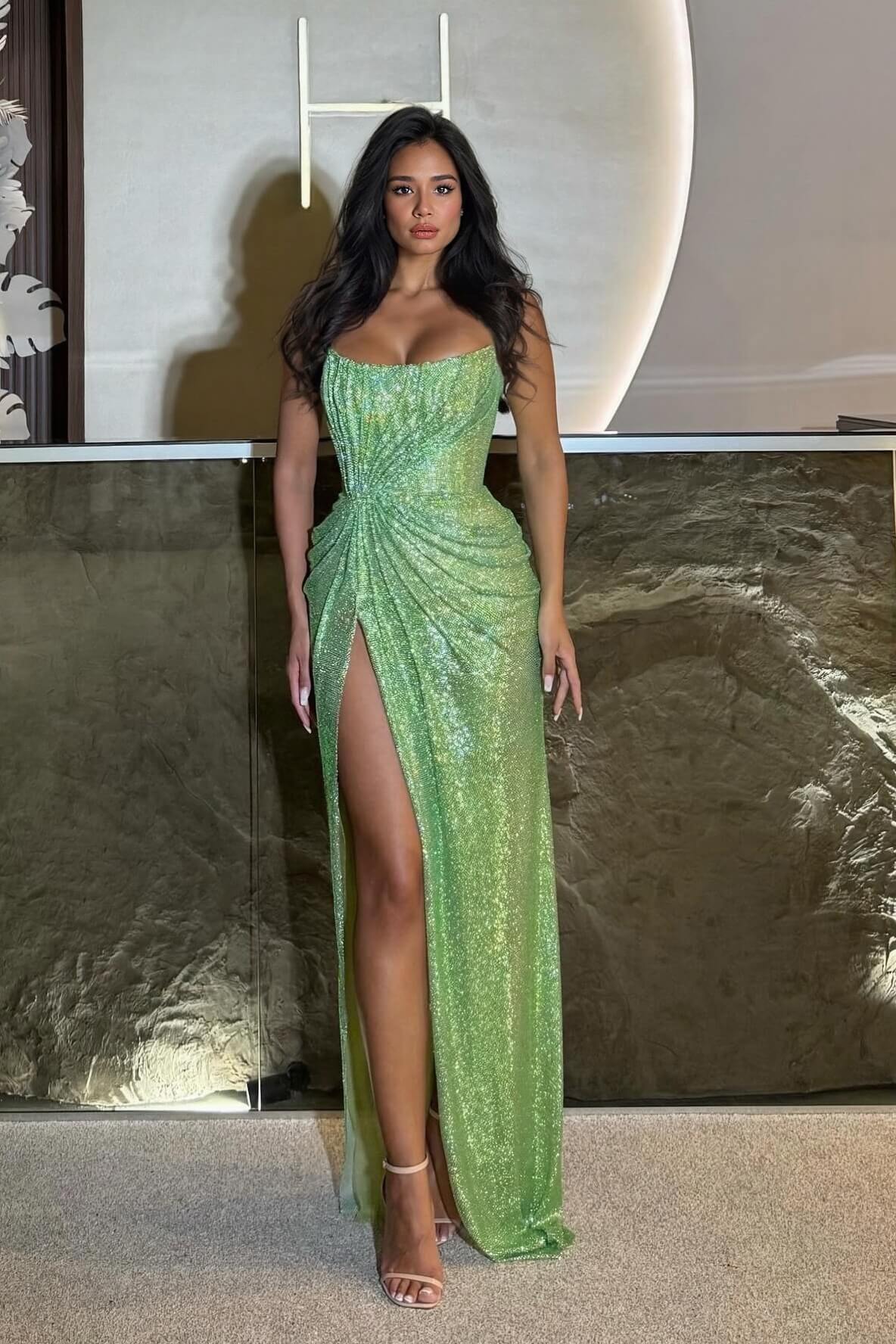 Green sequin bodycon maxi dress with ruched waist, spaghetti straps, high thigh slit.