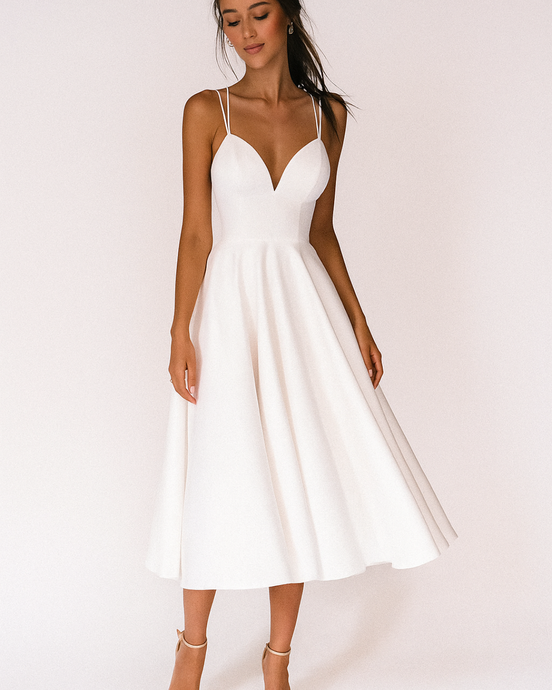 White strappy midi dress with V-neck and fitted bodice, A-line skirt