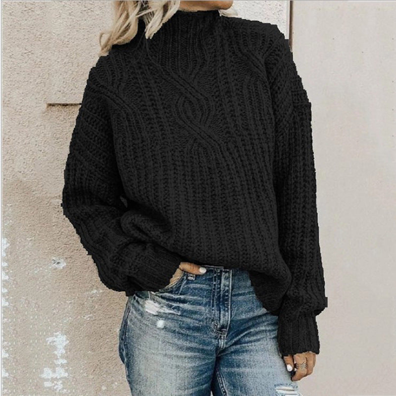 Women's black cable knit turtleneck sweater with long sleeves and ribbed cuffs