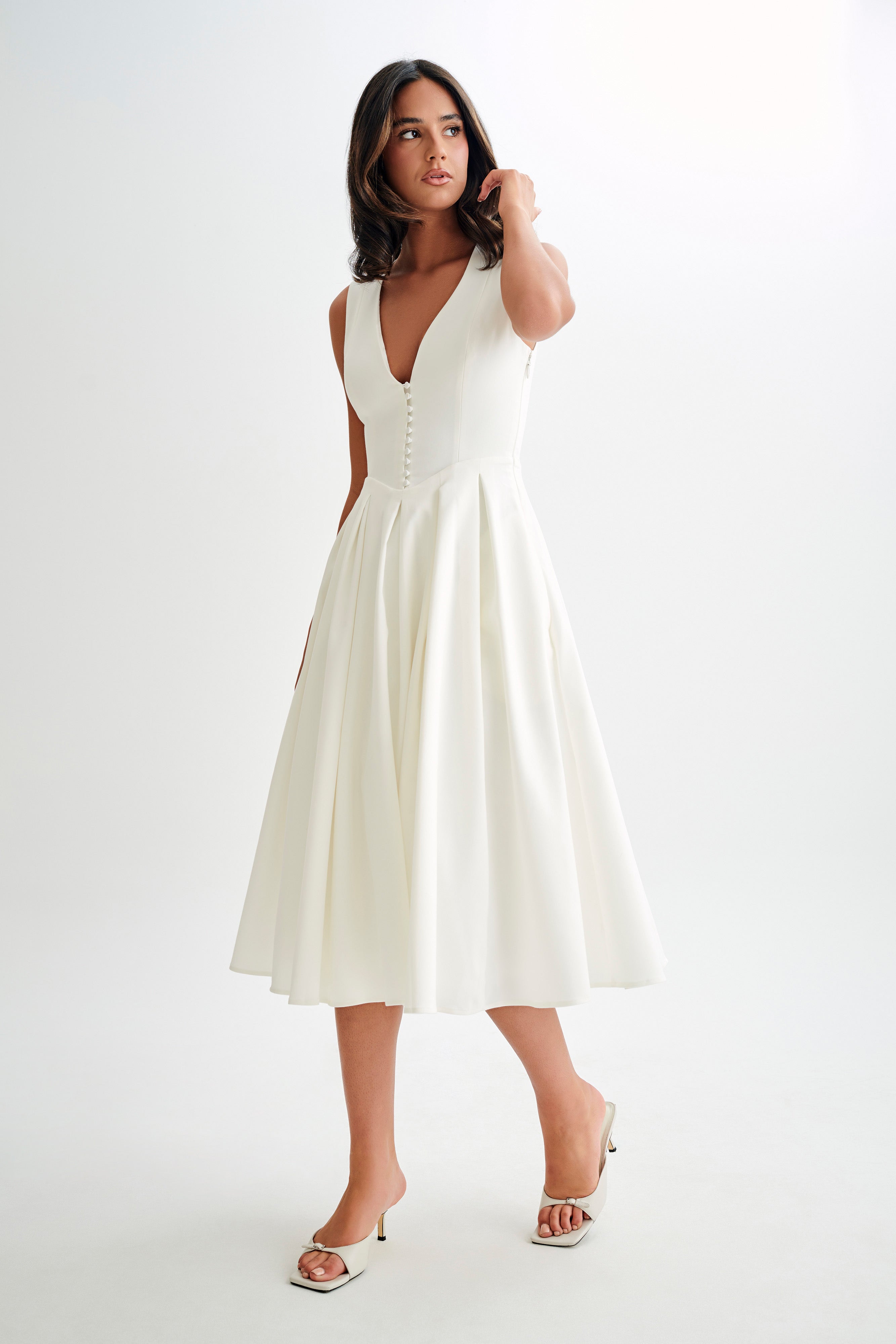 White satin A-line midi dress, sleeveless deep V with button front and flared skirt