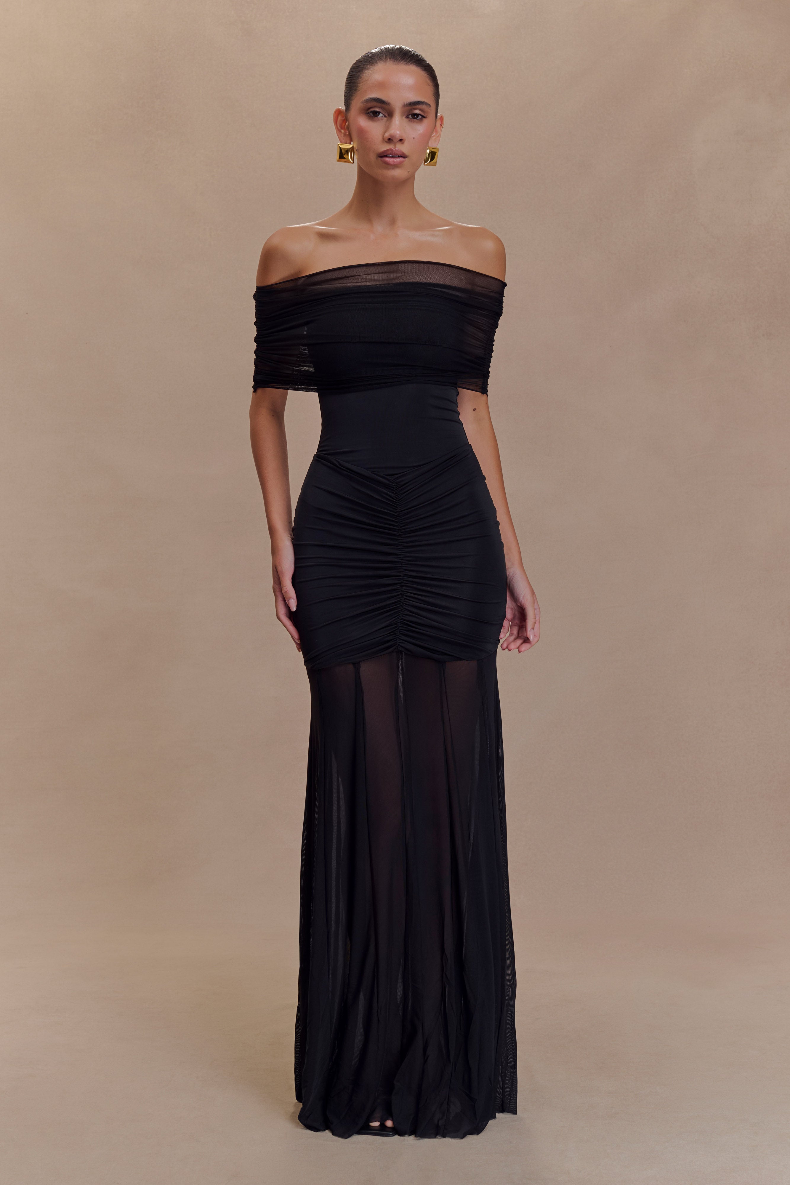 Black off-shoulder ruched bodycon maxi dress with sheer mesh skirt panel