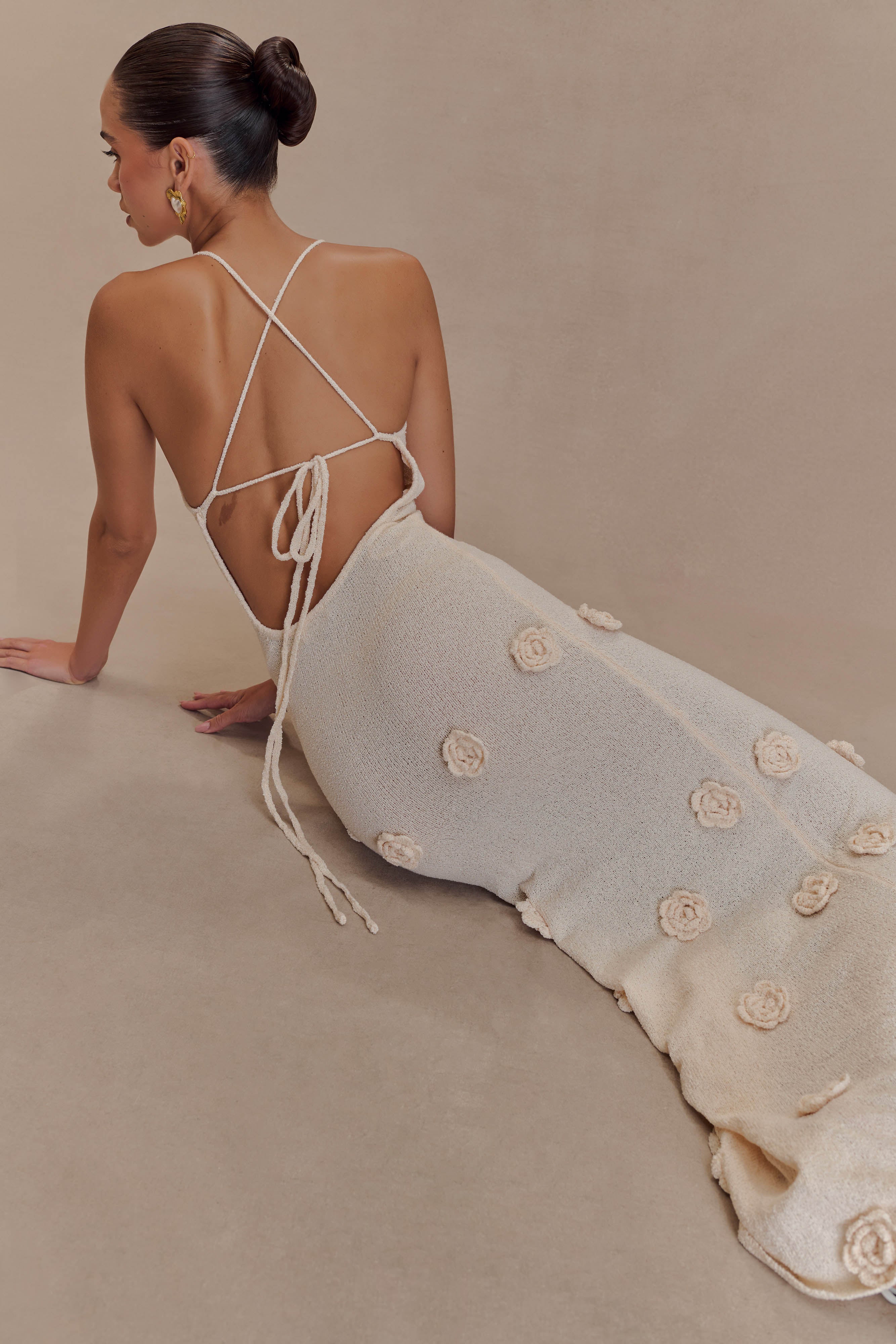 White knit spaghetti-strap maxi dress with open back and floral appliqué