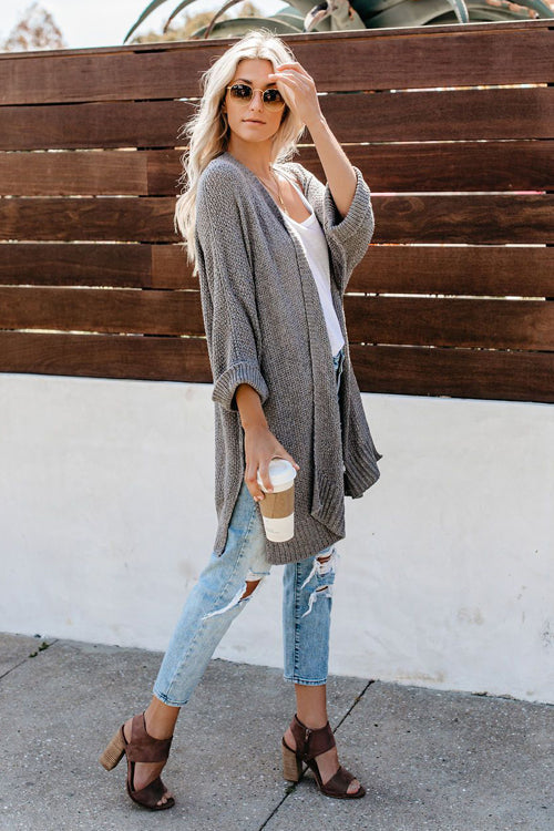Long sleeve knit cardigan in grey with open front and loose flowy silhouette