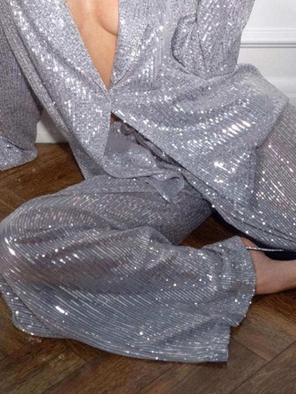 Silver sequined blazer close-up with open front and long relaxed sleeve