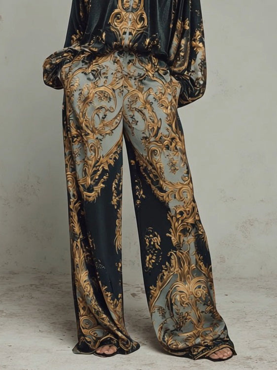 Wide-leg satin trousers and matching V-neck blouse, black with gold-and-cream baroque print