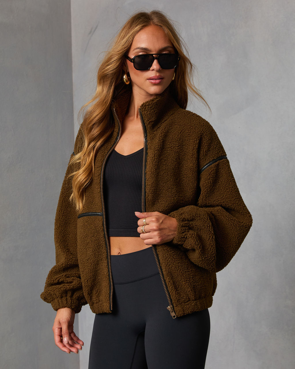 Brown shearling-style zip jacket with contrast trim and stand collar