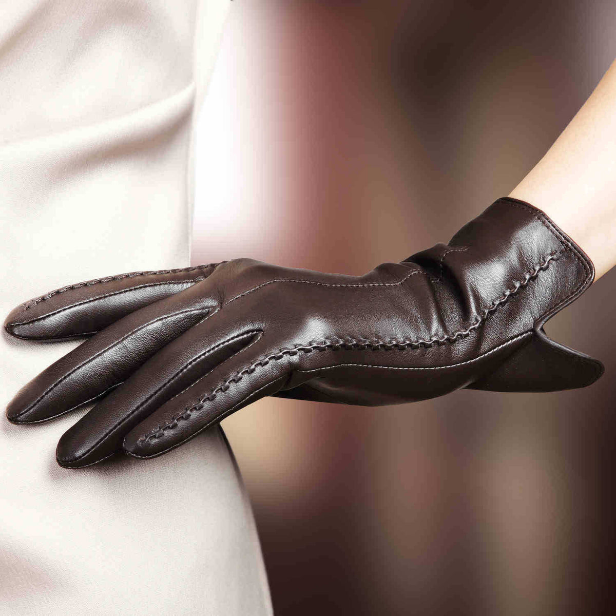 Brown leather women's gloves with stitched cuff and extended knuckles