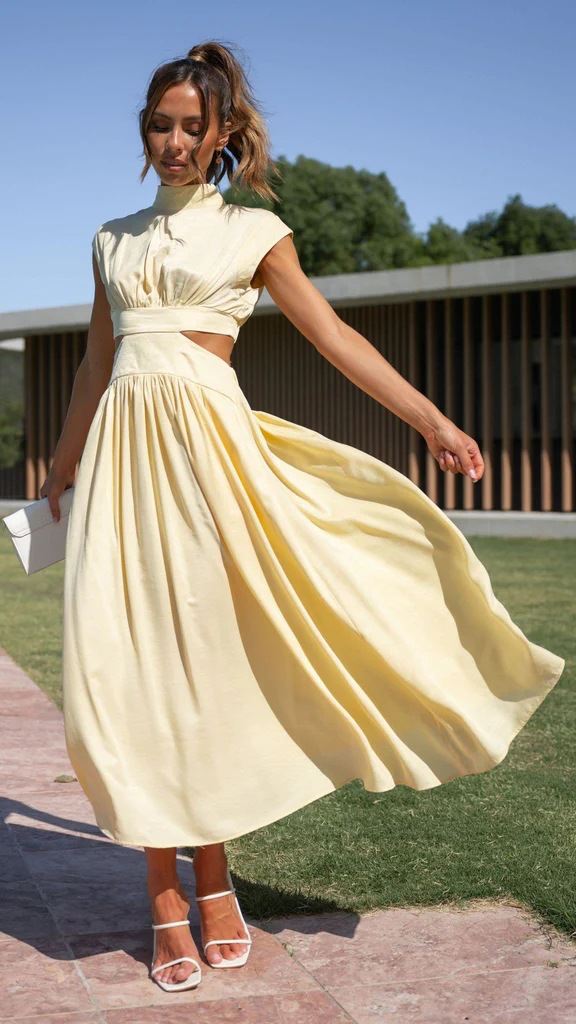 Cream mock-neck sleeveless maxi dress with ruched waist and full gathered skirt