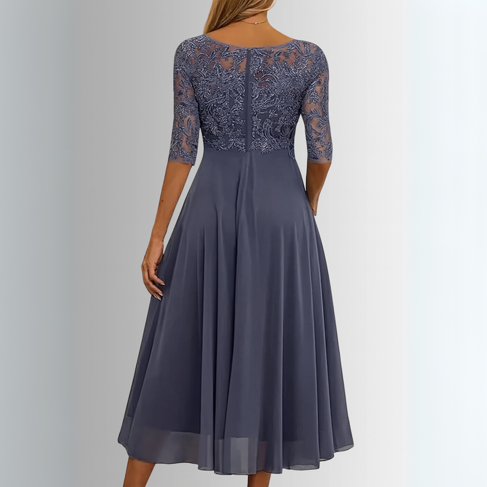 Back view of blue chiffon A-line dress with lace illusion sleeves, pleated skirt.