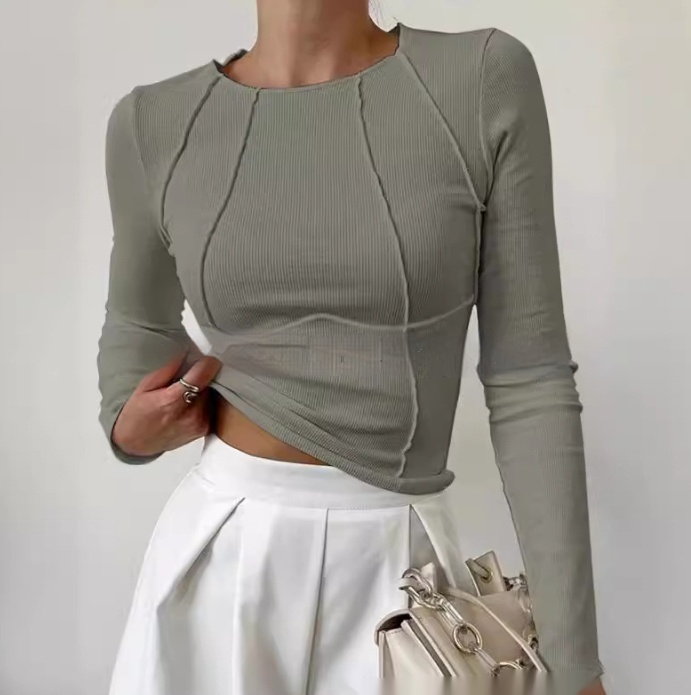 Sage green ribbed knit long-sleeve crewneck top with exposed seam detail, slim fit
