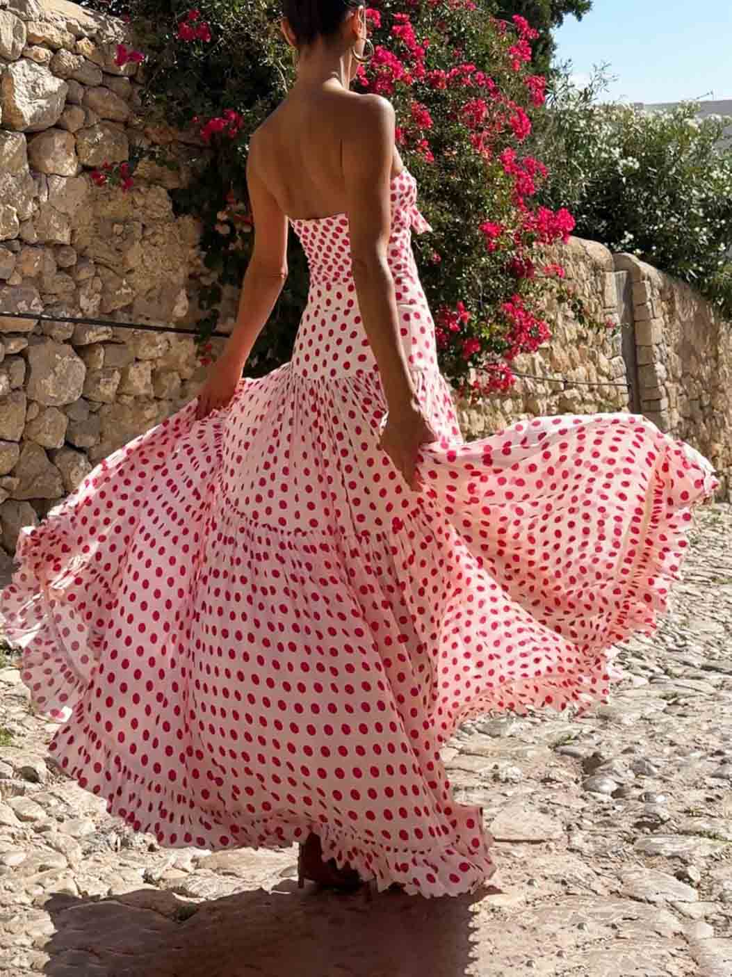 Pink heart-print strapless tiered ruffle maxi dress with full, twirly skirt.