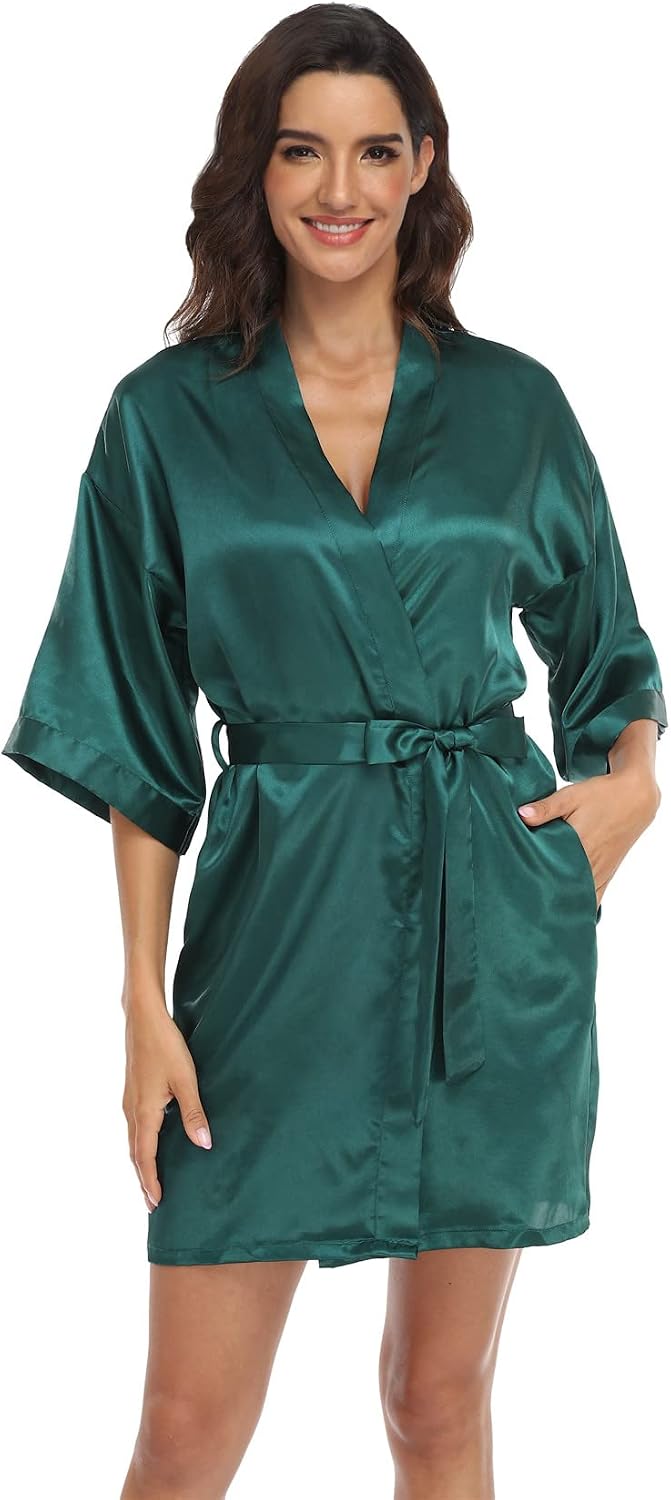 Women's dark green satin robe with a wrap front, wide sleeves, tie belt and pockets