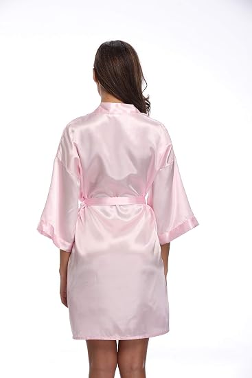 Back view of a pale pink satin robe with wide sleeves and a waist tie