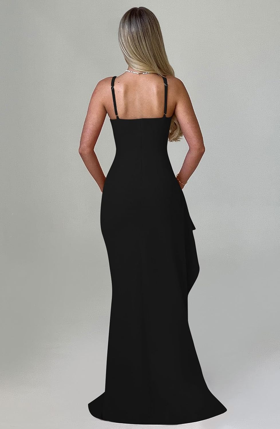 Back view of black maxi gown with thin straps and a straight back neckline