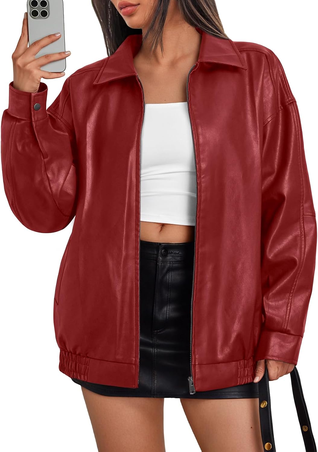 Red oversized leather bomber jacket with a zip front, wide collar, and elastic hem