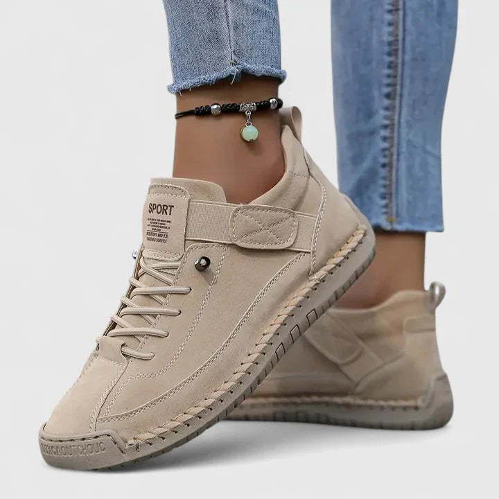 Beige faux leather lace-up sneakers with ankle strap and beige rubber sole