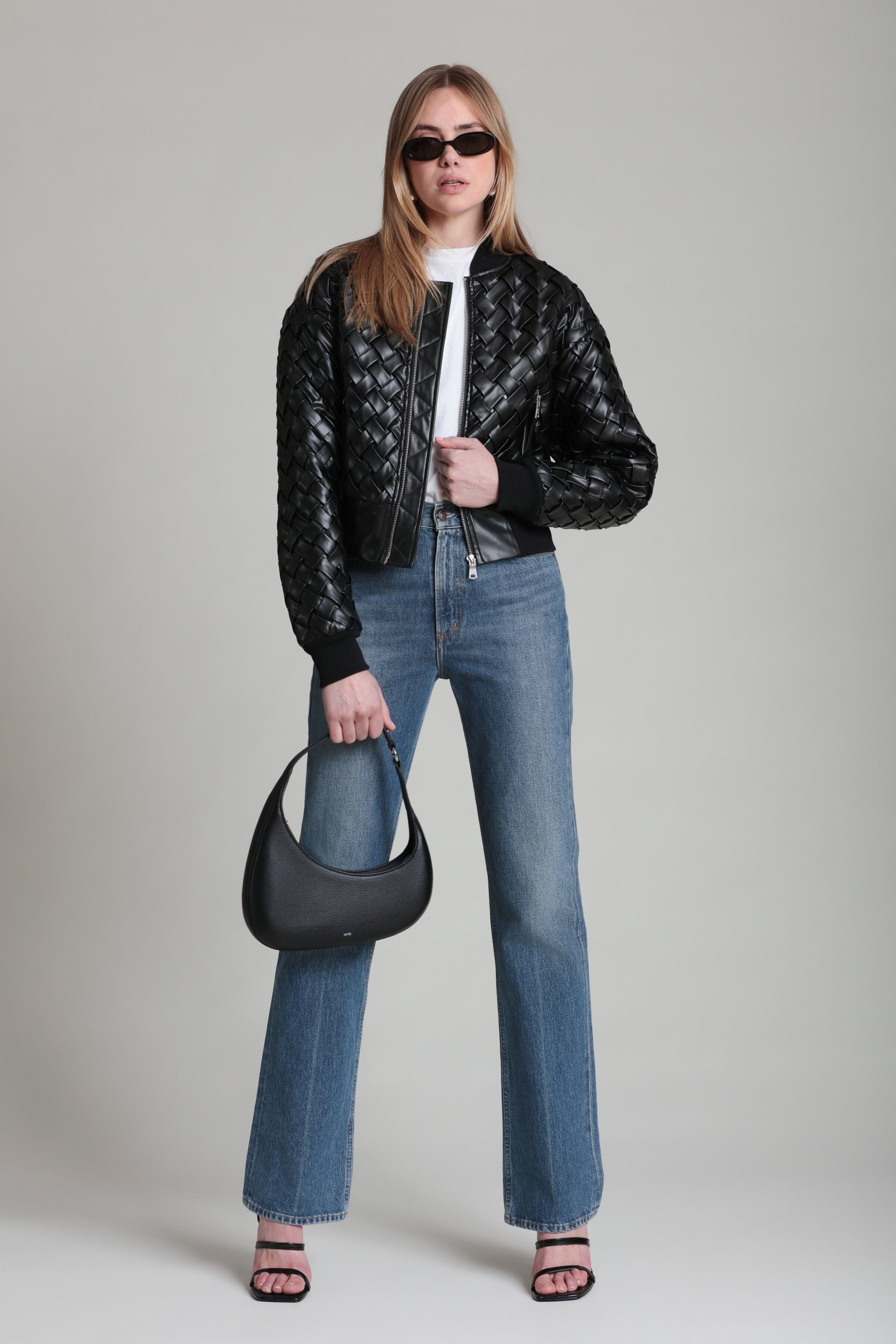 Black woven faux leather bomber jacket, front zipper, ribbed cuffs with jeans pairing