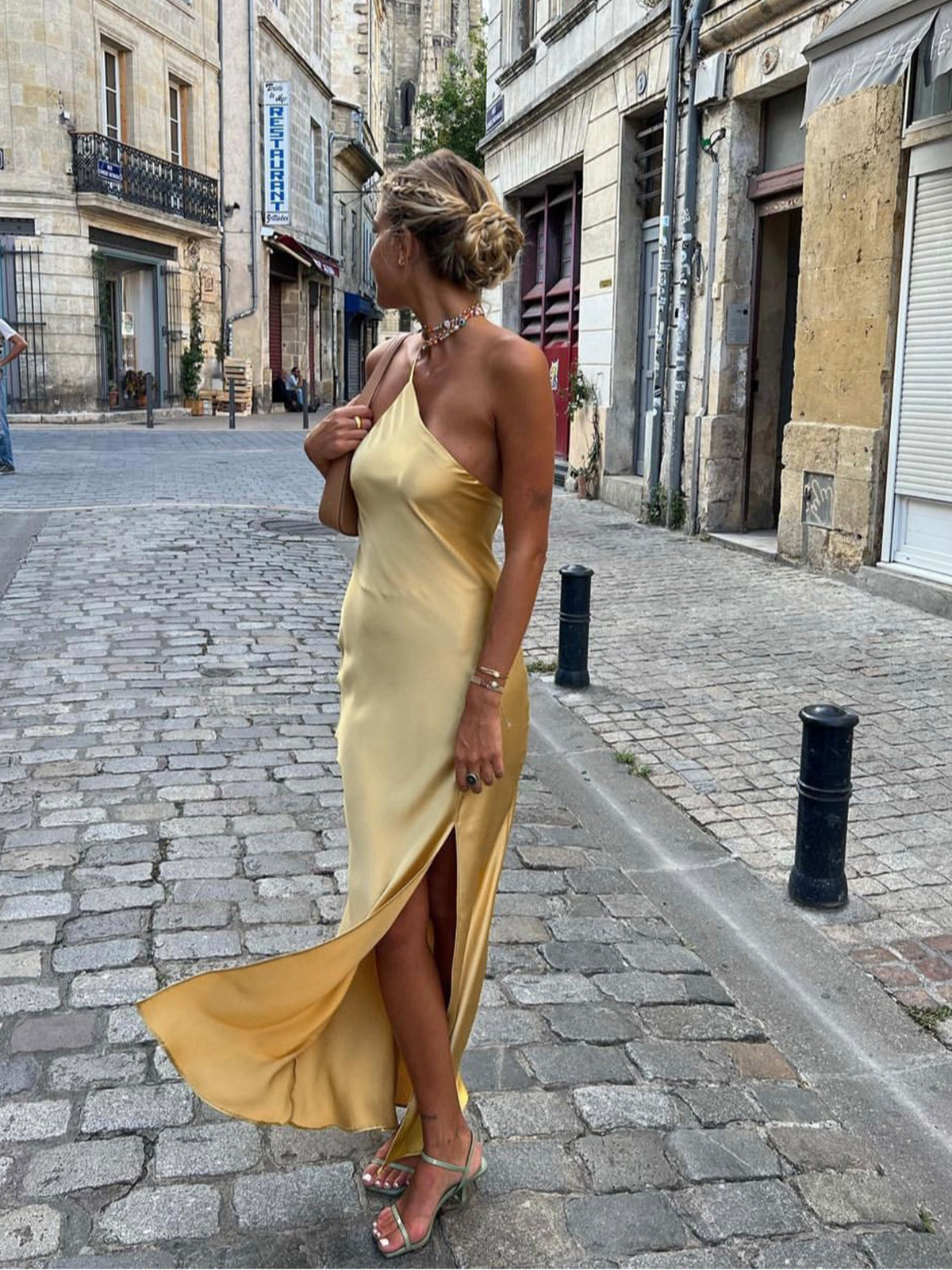Yellow satin one-shoulder maxi dress with backless cowl back and high slit
