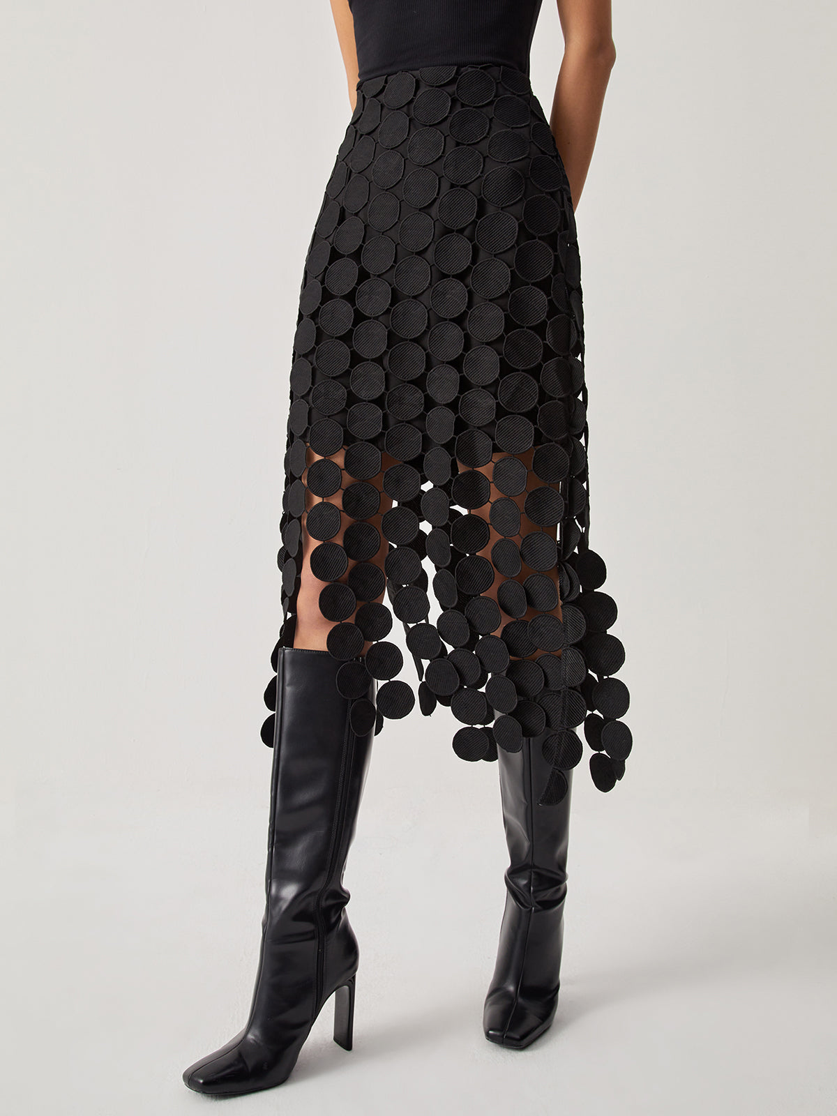 Black mesh midi skirt with high waist and circular disc overlay, scalloped hem
