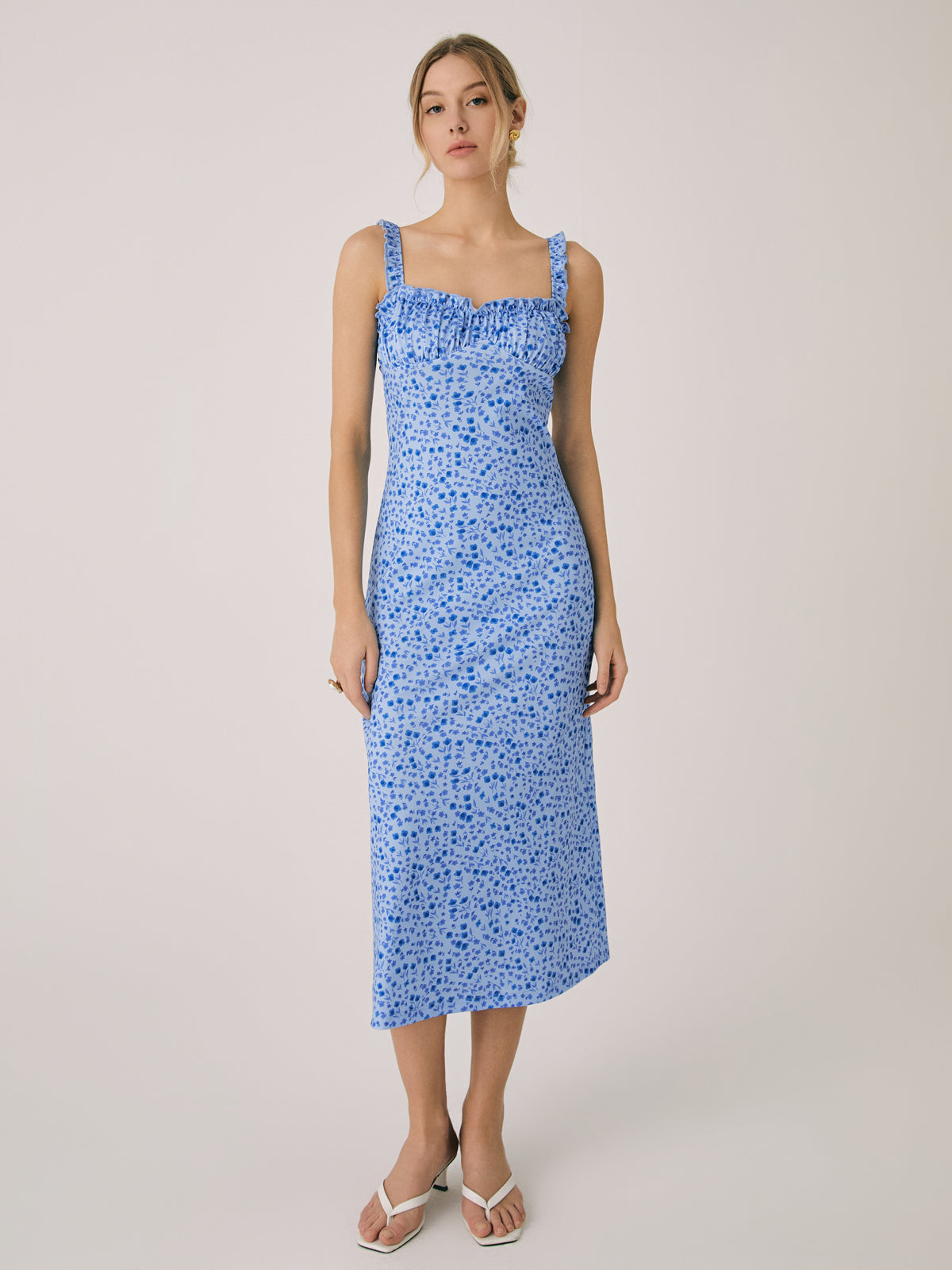 Blue floral spaghetti-strap midi dress with ruched bust and ruffle-trimmed hem