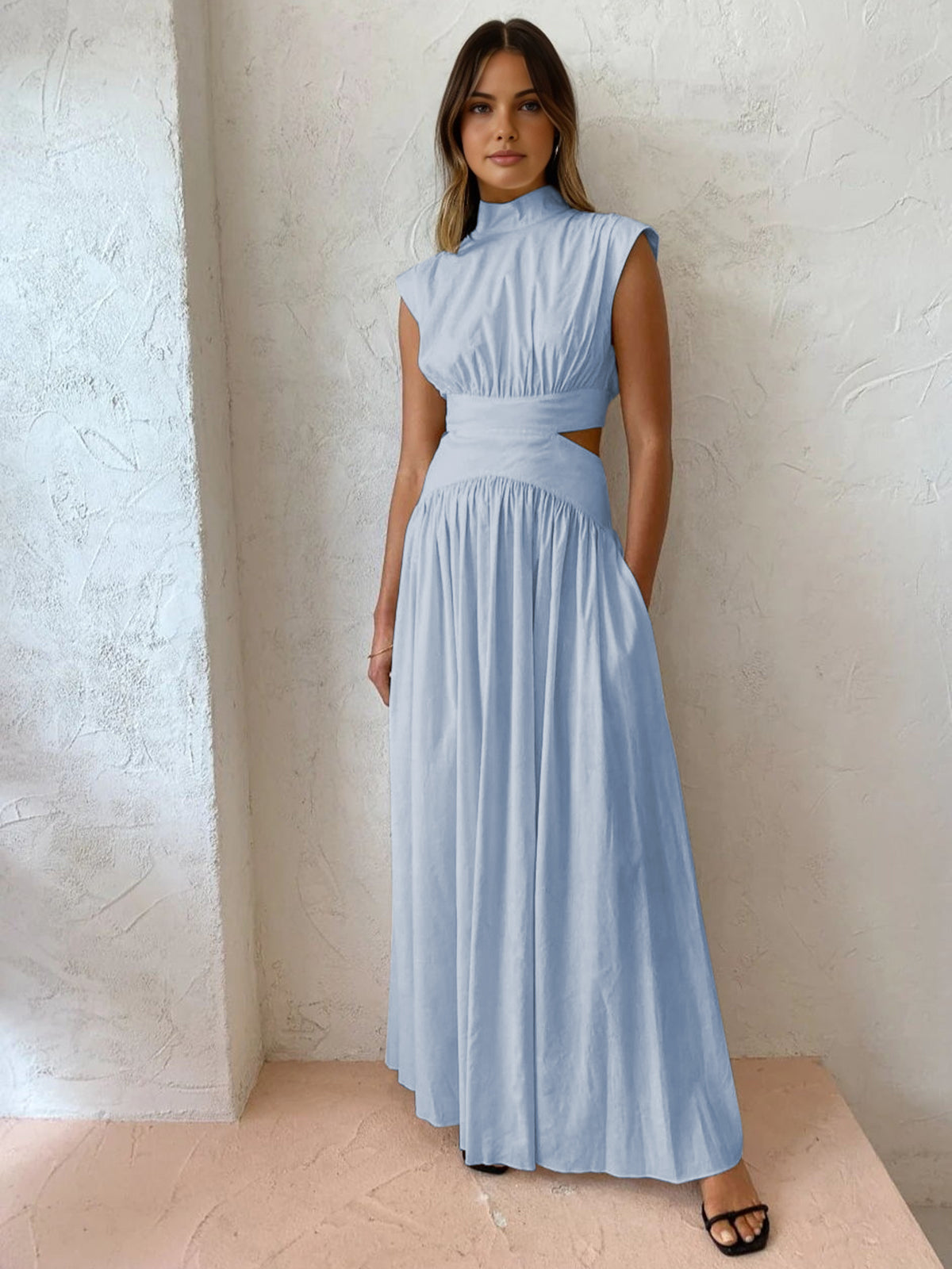 Light blue sleeveless mock-neck maxi dress with ruched bodice and gathered full skirt