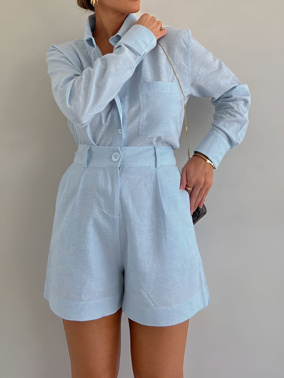 Light blue linen long-sleeve button shirt with belted high-waist shorts set