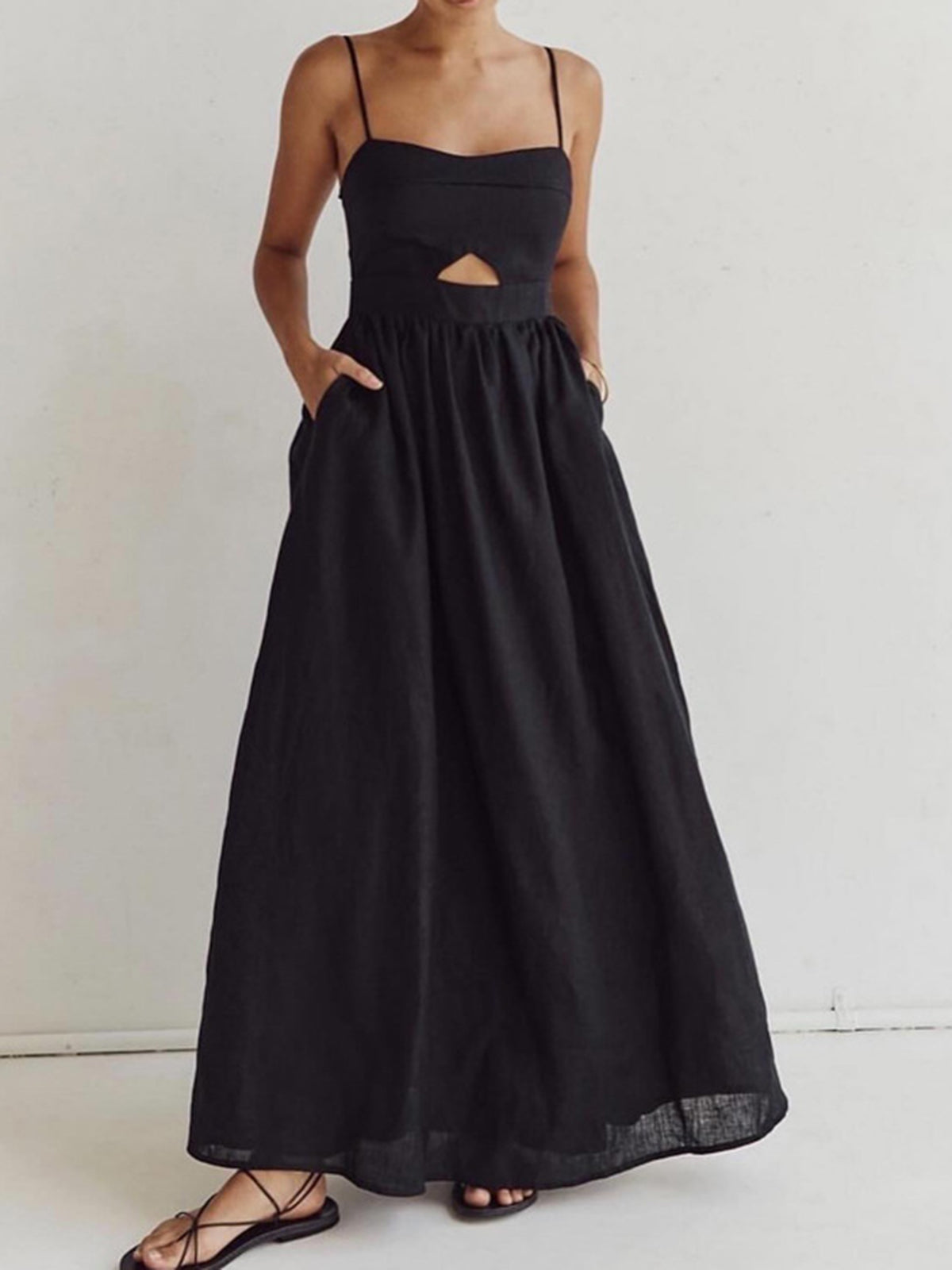 Black spaghetti strap A-line maxi dress with cutout waist and gathered bodice