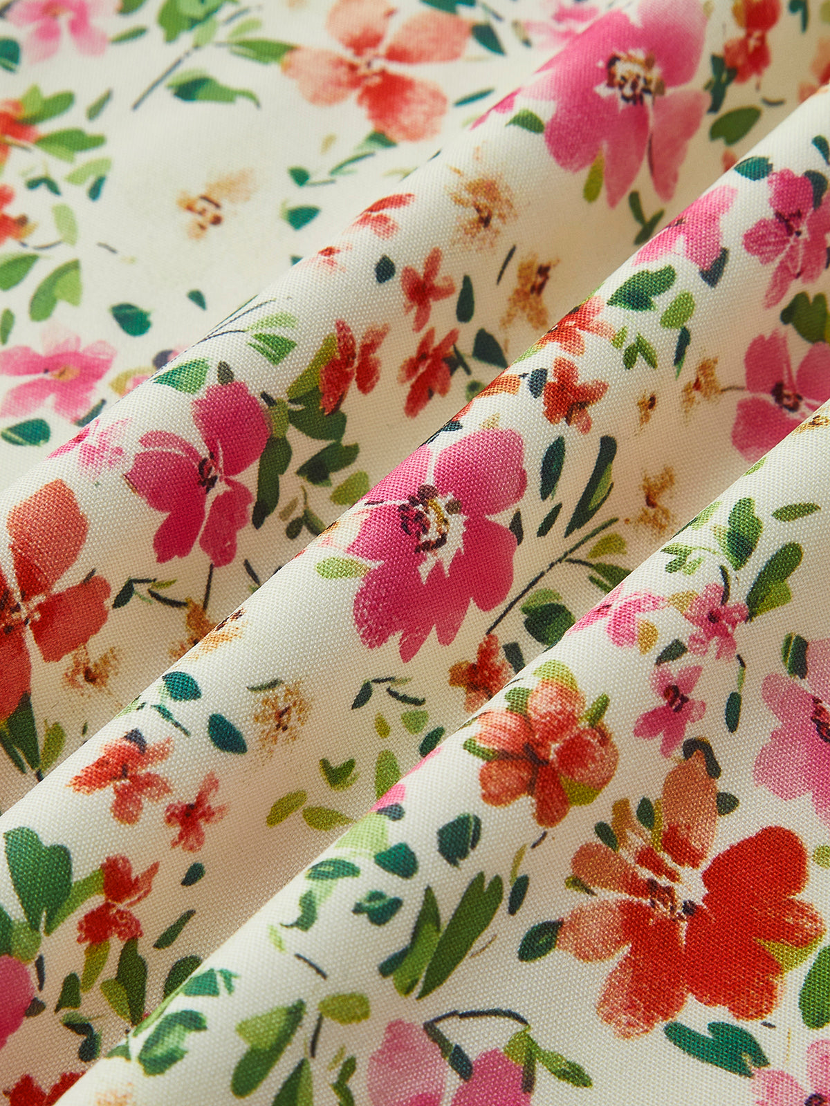 Close-up of off-white ditsy floral fabric with multicolor blossoms