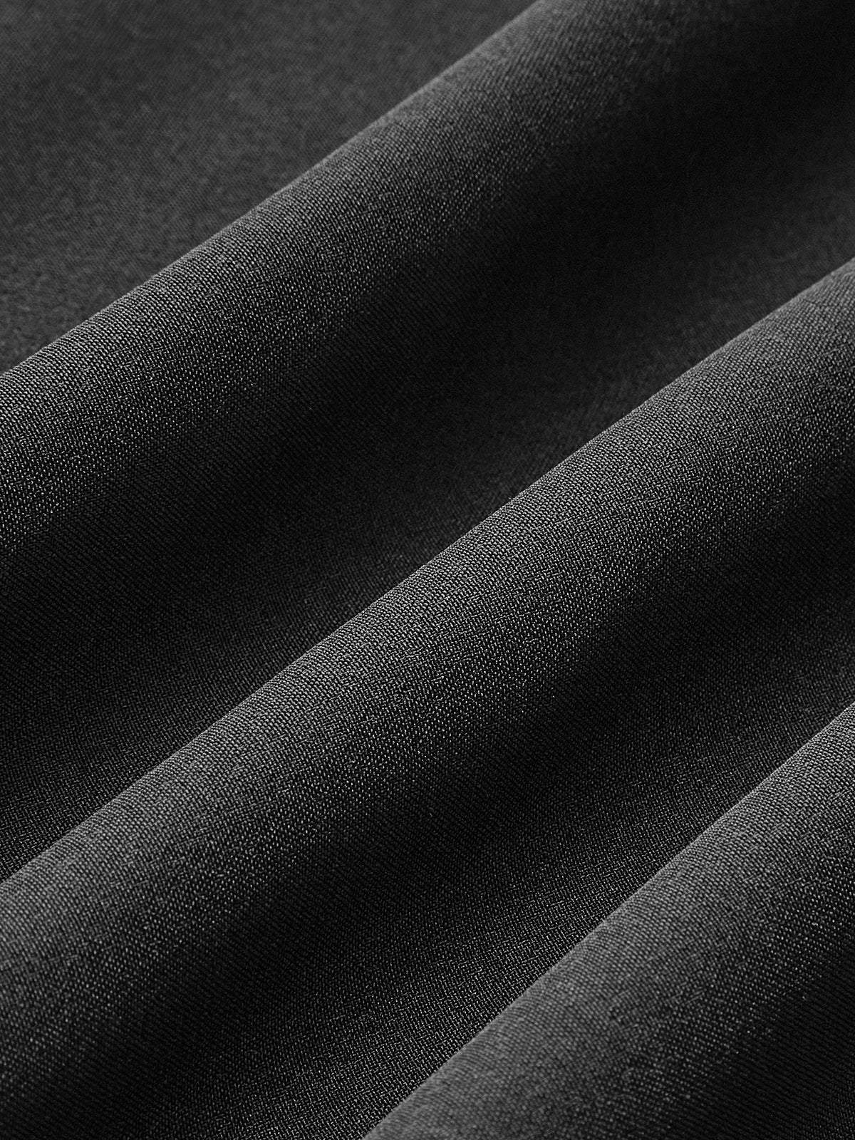 Black woven fabric closeup with fine texture