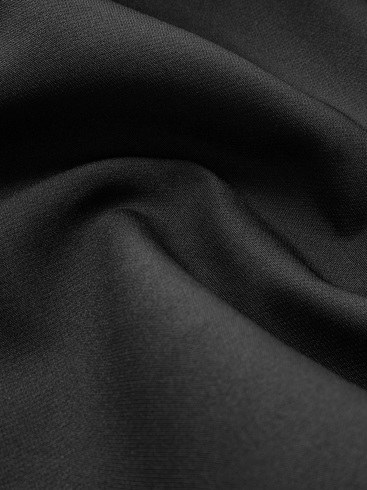 Black crepe fabric texture close-up for V-neck cap sleeve blouse