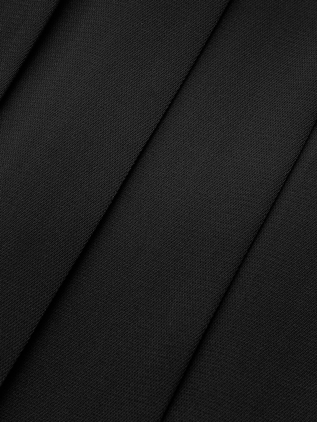 Close-up of black textured fabric panels with fine leather grain