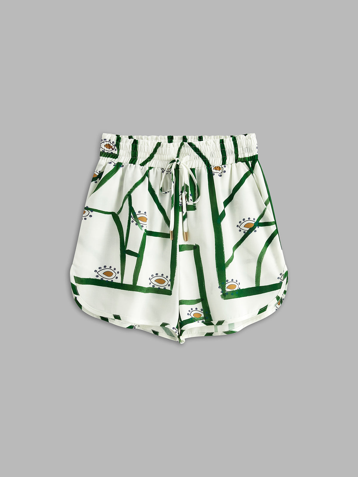 Matching shorts from a printed set, white with green stripe-and-motif pattern