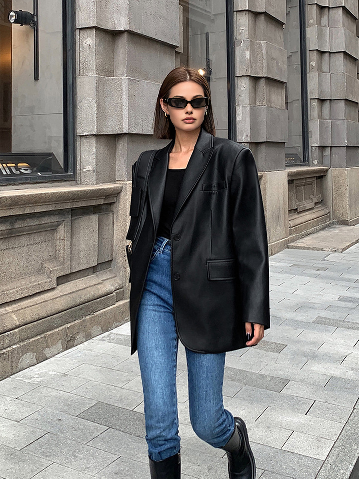 Black faux leather blazer with flap chest pocket and single-button closure
