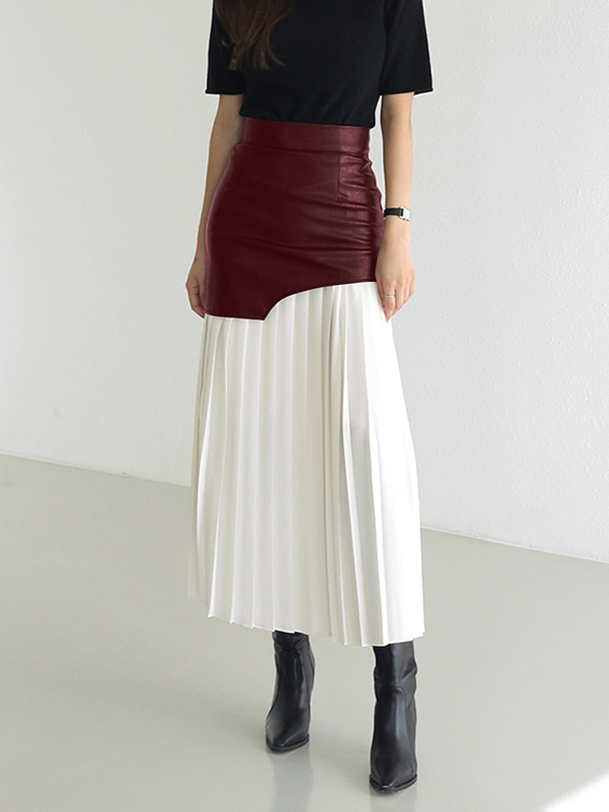 High-waist asymmetric leather maxi skirt with burgundy leather panel and white pleated panel