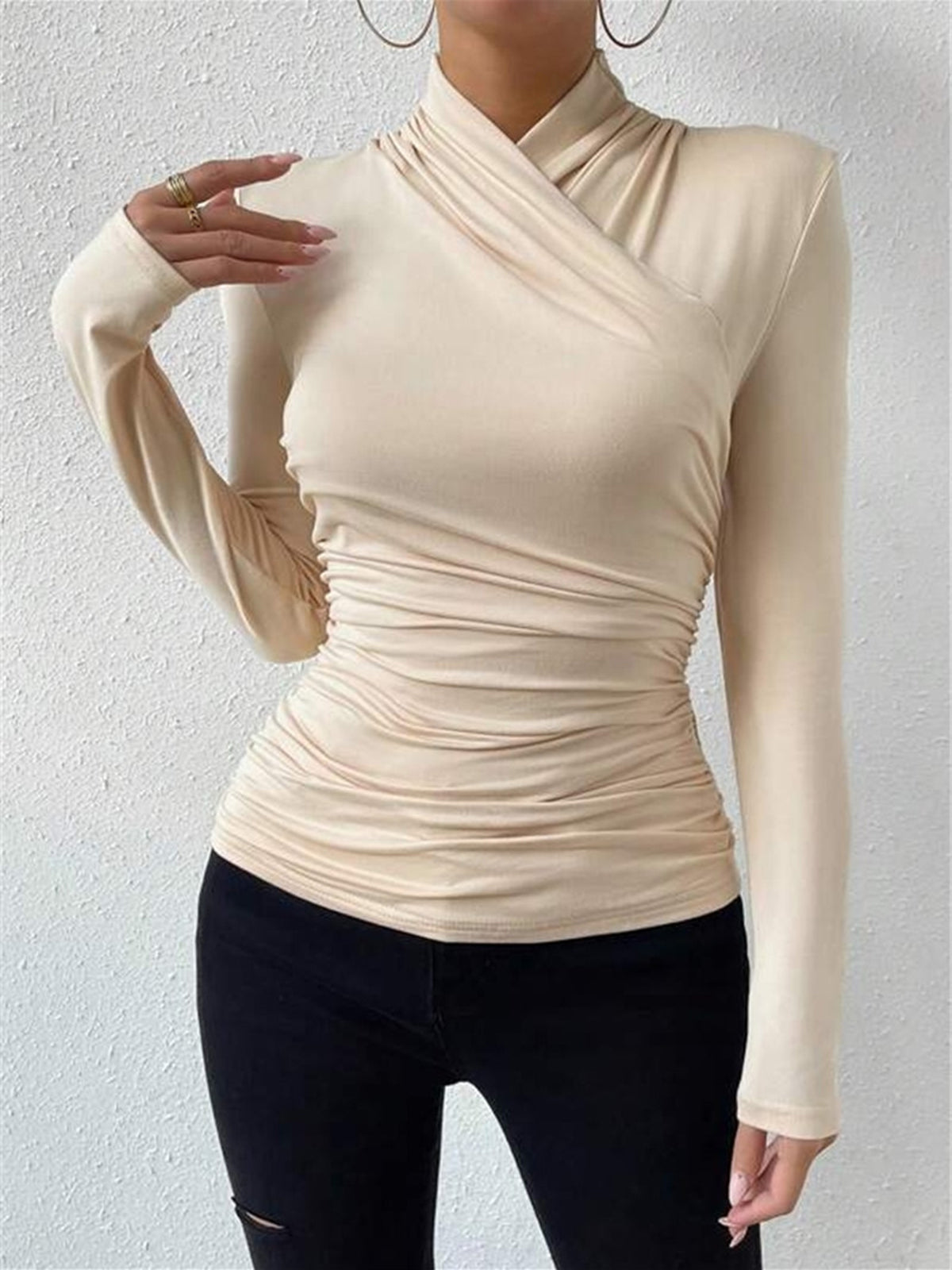 Apricot mock-neck long-sleeve wrap top with ruched waist and gathered crossover