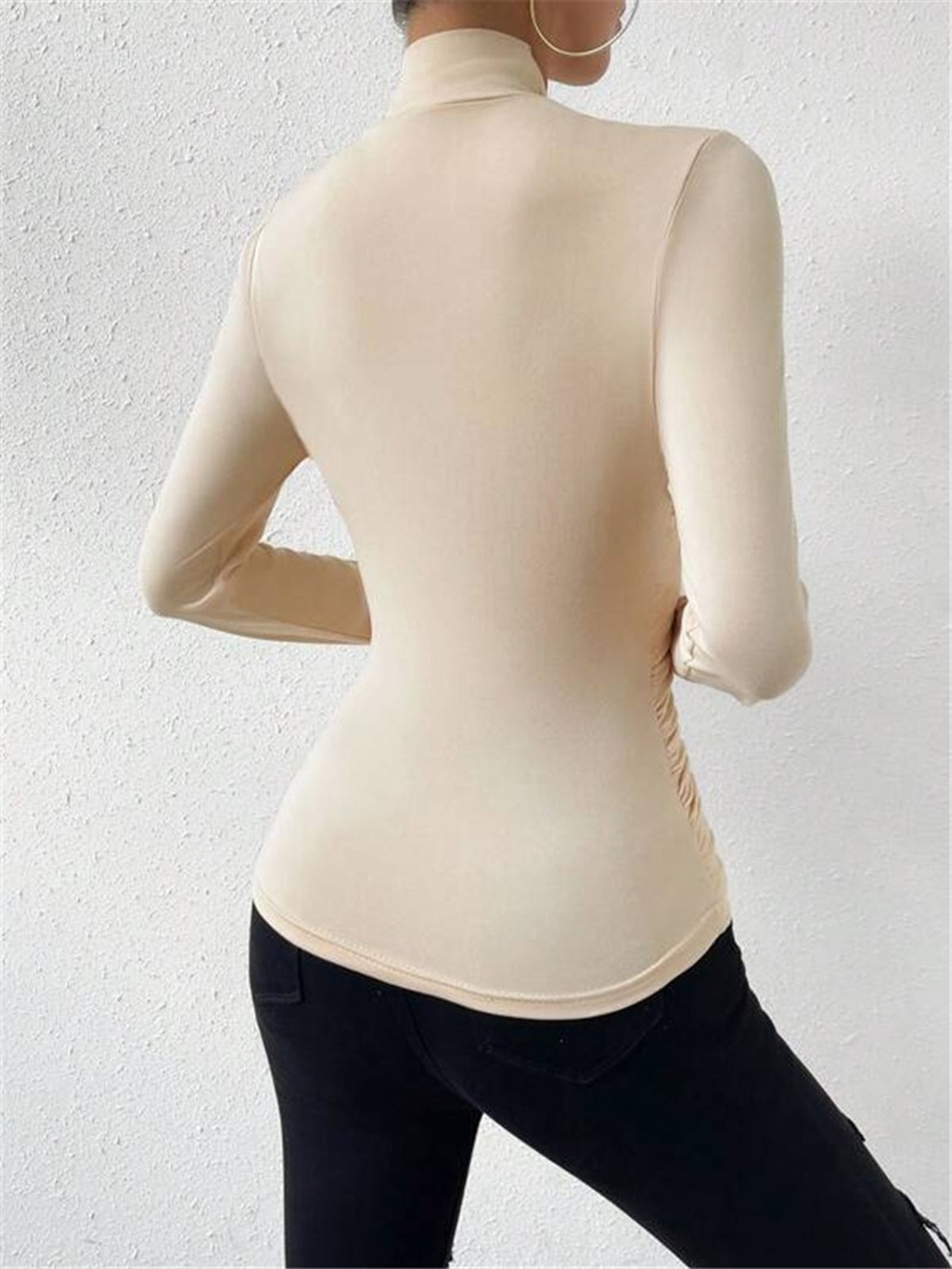 Apricot mock-neck long-sleeve top, back view with smooth fitted silhouette