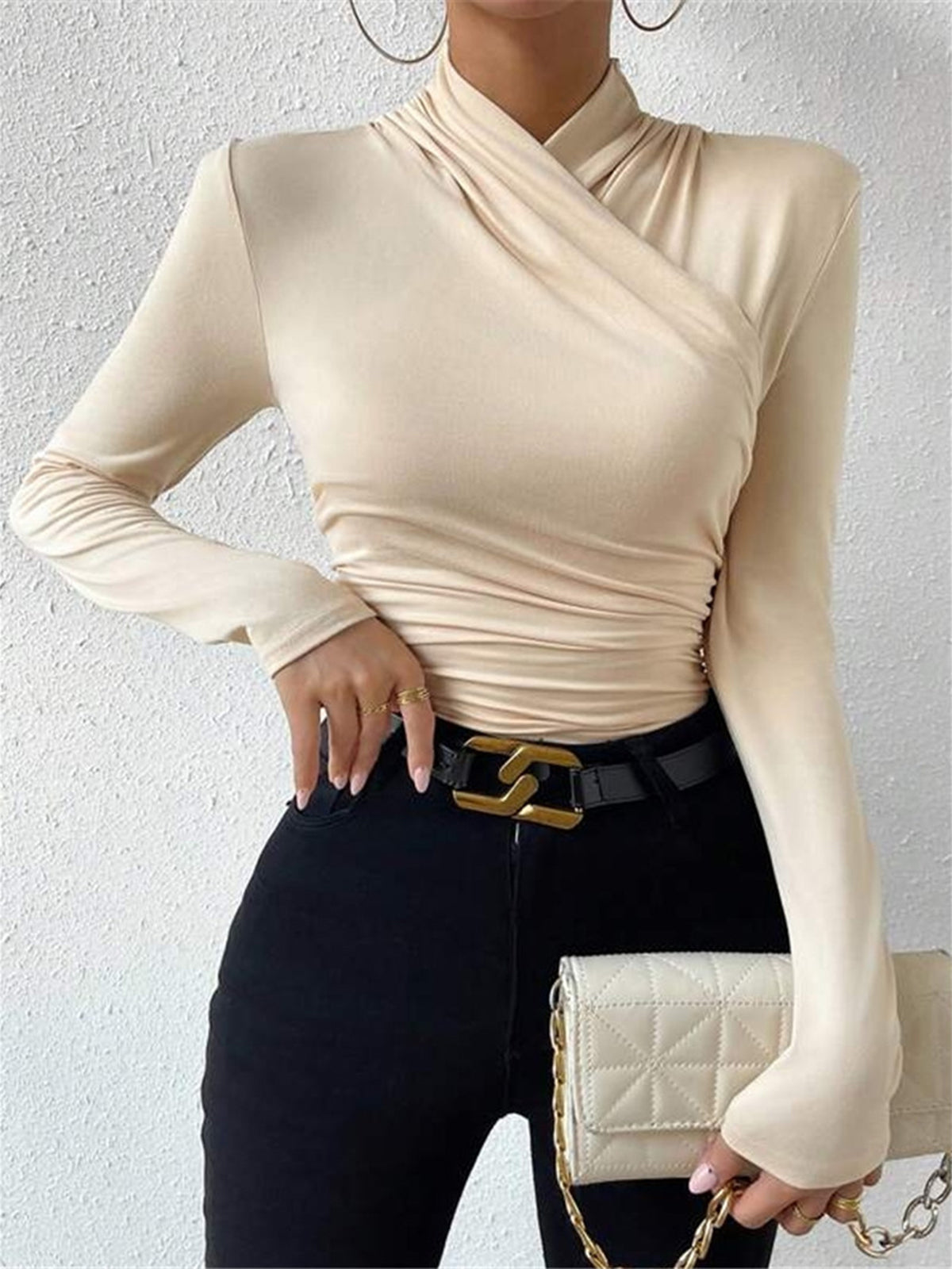Apricot mock-neck long-sleeve wrap top with ruched waist and crossover detail