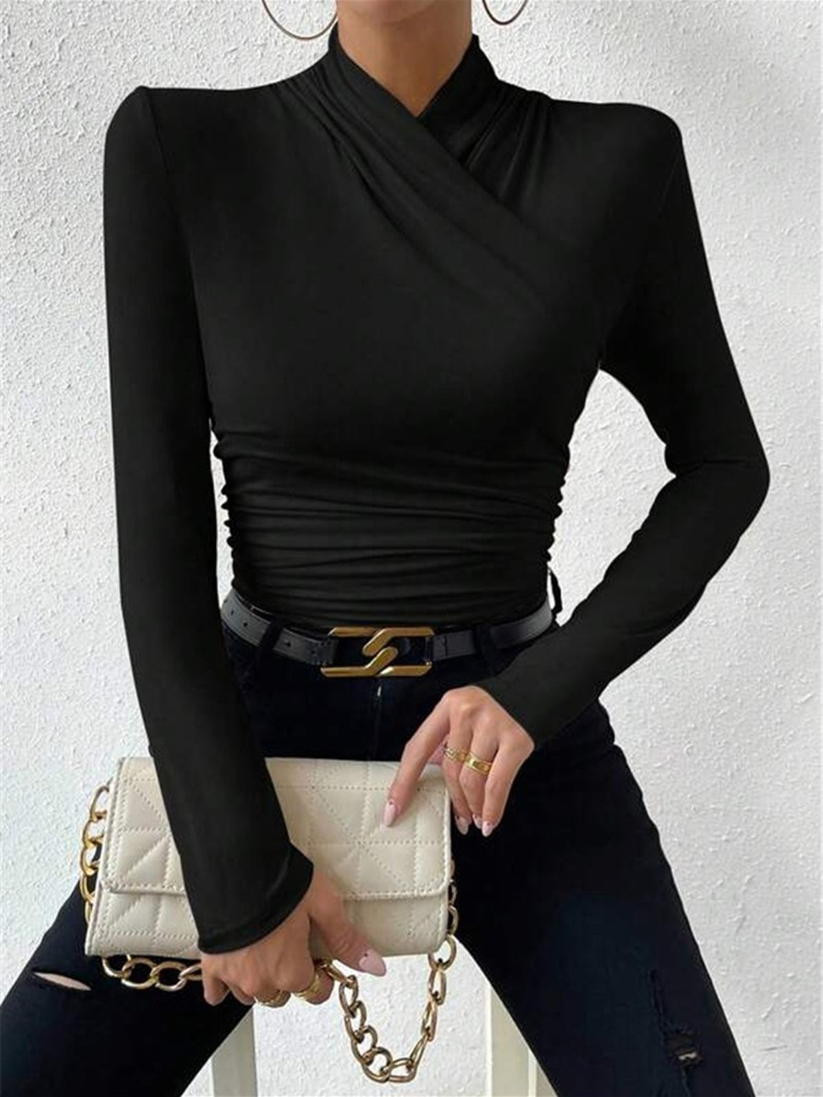 Black mock-neck long-sleeve wrap top with ruched waist and crossover detail