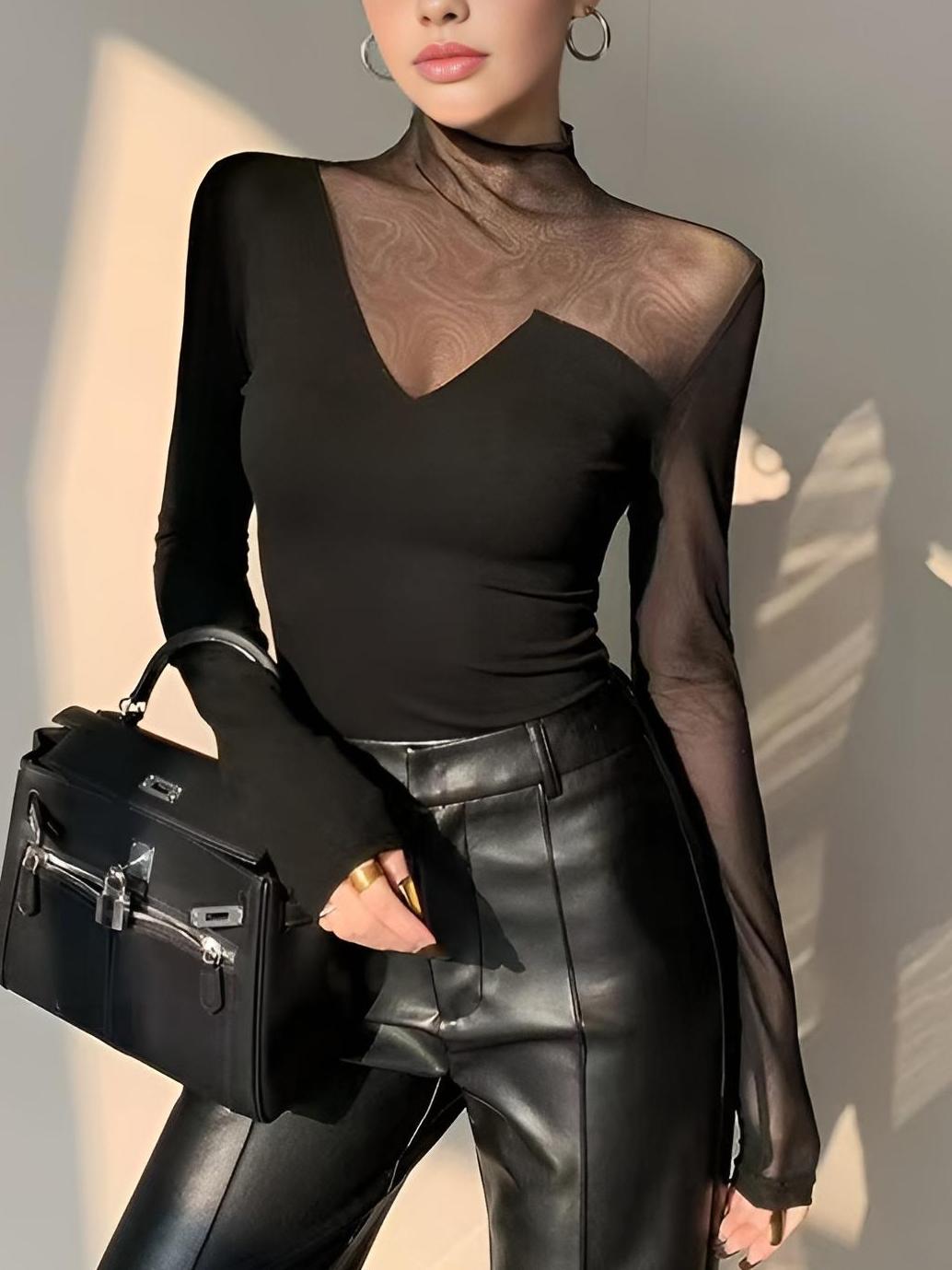Black sheer long-sleeve mock neck top with V-shaped asymmetric panel on chest